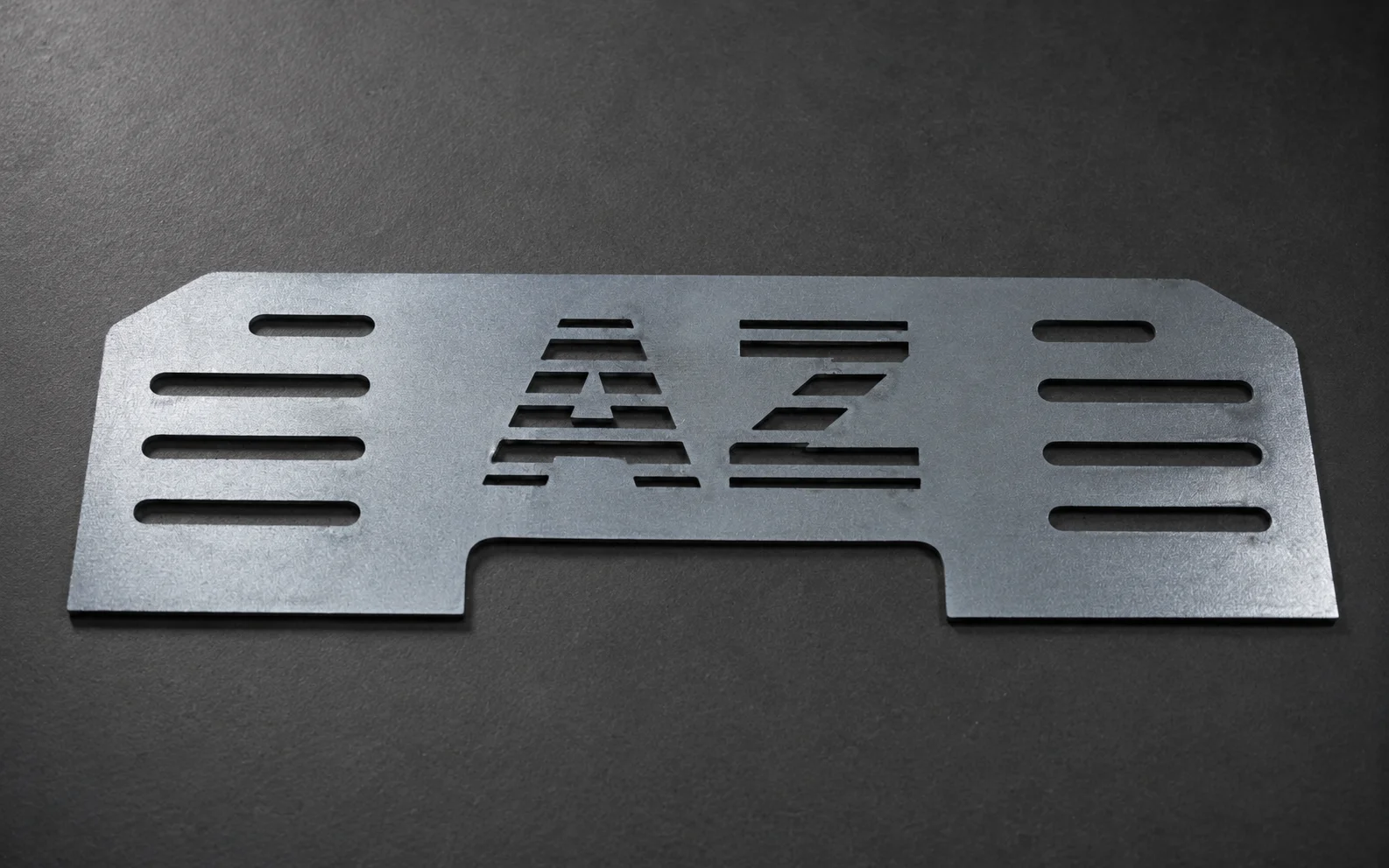 Laser-cut carbon steel enclosure front cover