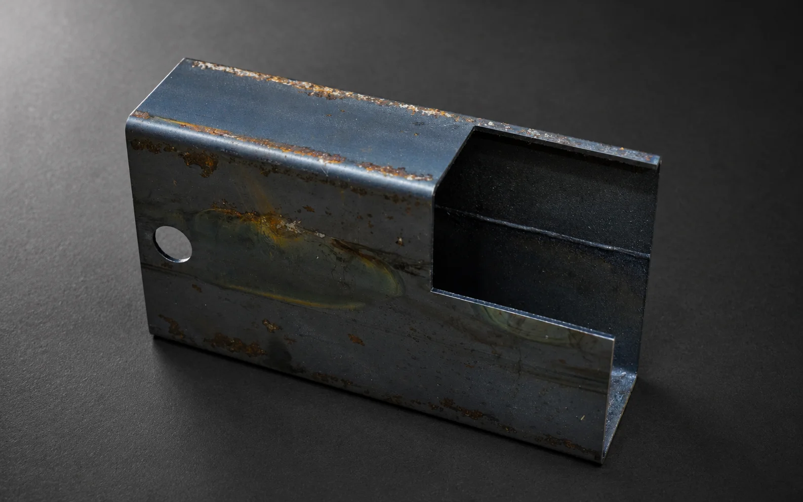 Laser-cut slots in square tube
